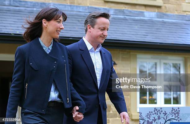 Prime Minister David Cameron and his wife Samantha leave a show home during a visit to Story Homes Help to Buy development site on May 6, 2015 in...