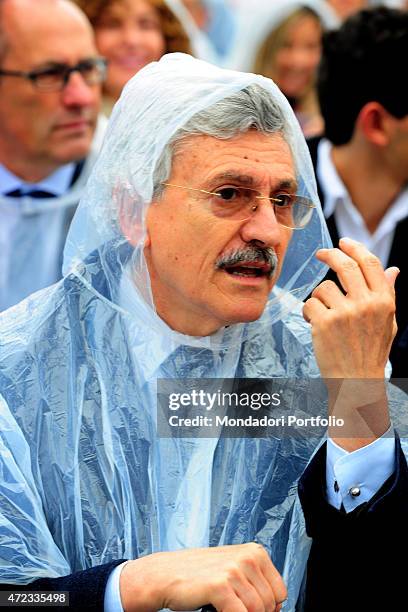 "Italian politician Massimo D'Alema wearing a raincoat at the opening ceremony of Expo Milano ""Feeding the planet, Energy for life"". Milan, 1st May...