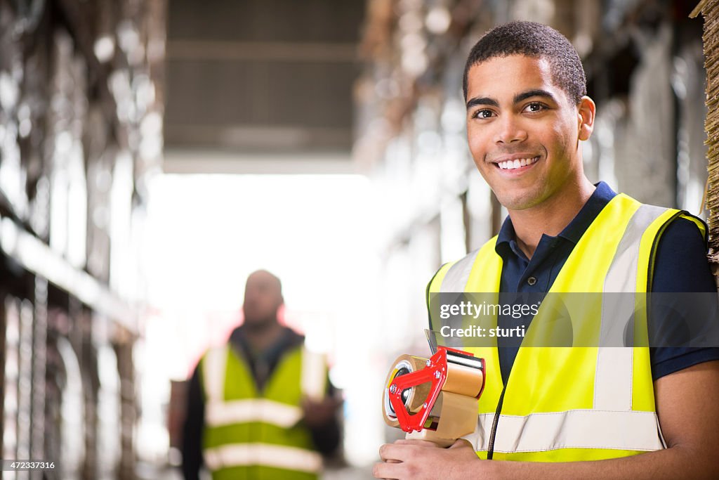 Young male warehouse worker portrait