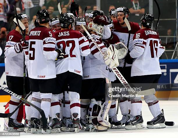 The team of Latvia celebrate after winning the IIHF World Championship group A match between Switzerland and Latvia at o2 Arena on May 6, 2015 in...