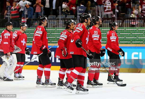 Team members of Switzerland look dejected after losing the IIHF World Championship group A match between Switzerland and Latvia at o2 Arena on May 6,...