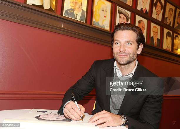 Bradley Cooper gets honored with a Sardi's Caricature in honor of his performance as "John Merrick" in "The Elephant Man" on Broadway at the...