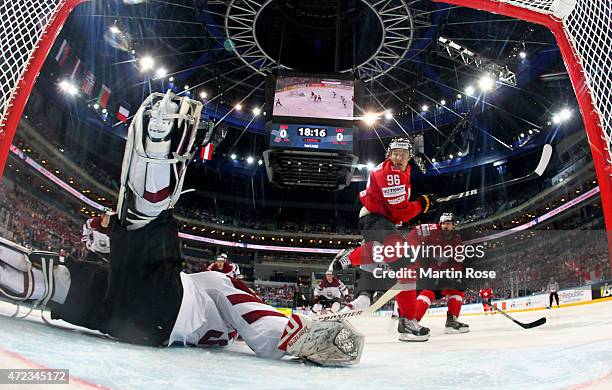 Edgars Masalskis , goaltender of Latvia makes a save during the IIHF World Championship group A match between Switzerland and Latvia at o2 Arena on...