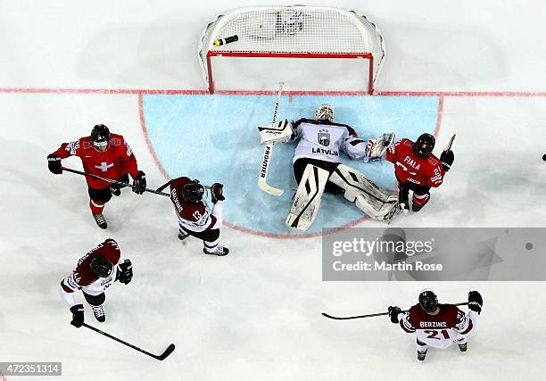 Edgars Masalskis , goaltender of Latvia makes a save during the IIHF World Championship group A match between Switzerland and Latvia at o2 Arena on...