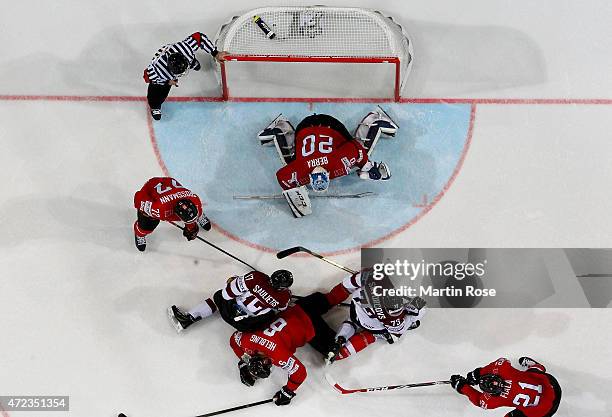 Players of Switzerland and of Latvia battle for the puck in front of the net during the IIHF World Championship group A match between Switzerland and...