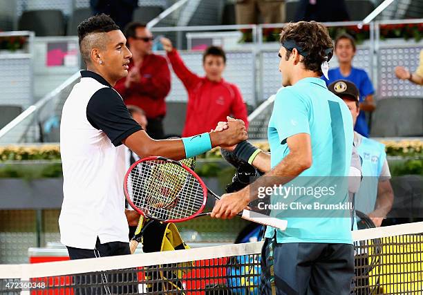 Nick Kyrgios of Australia shakes hands at the net after his three set victory against Roger Federer of Switzerland in their second round match during...