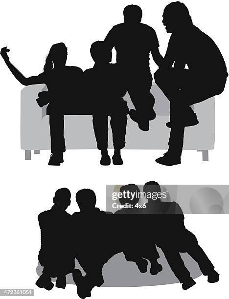 silhouettes of friends sitting on couch - bean bag stock illustrations