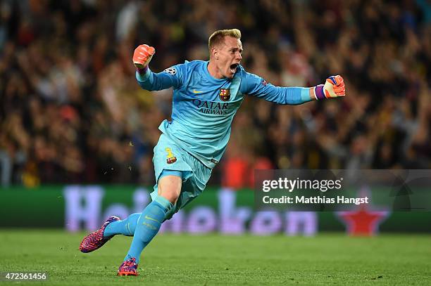 Goalkeeper Marc-Andre ter Stegen of Barcelona celebates as teammate Lionel Messi scores the opening goal during the UEFA Champions League Semi Final,...