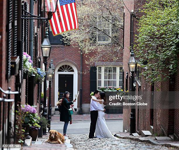 Geoff Li and Sharon Wang posed for pre-wedding photos taken by their friend Stacy Song as Na Zhao assisted on Acorn Street in Beacon Hill.