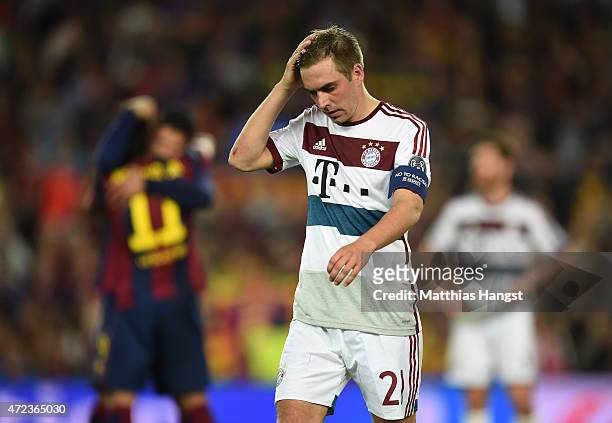 Dejected Philipp Lahm of Bayern Muenchen reacts following his team's 3-0 defeat during the UEFA Champions League Semi Final, first leg match between...