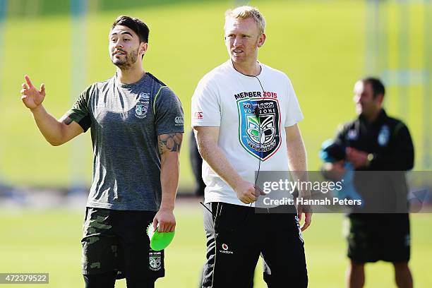 Shaun Johnson of the Warriors runs through drills with assistant coach Andrew Webster of the Warriors during a New Zealand Warriors NRL training...