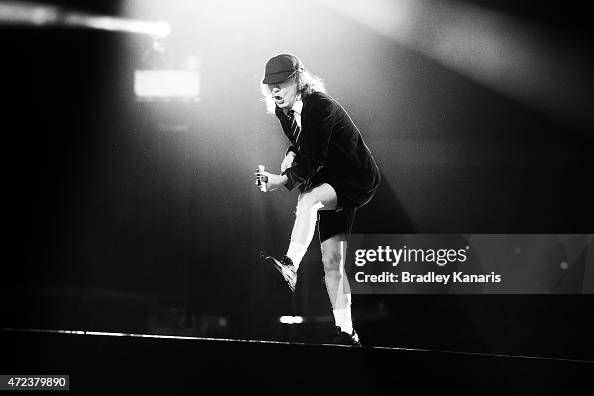 Lead guitarist Angus Young does his famous duck walk as AC/DC perform ...
