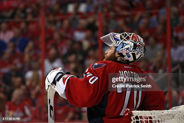 Goalie Braden Holtby of the Washington Capitals looks on after allowing a goal by Derick Brassard of the New York Rangers during the second period in...
