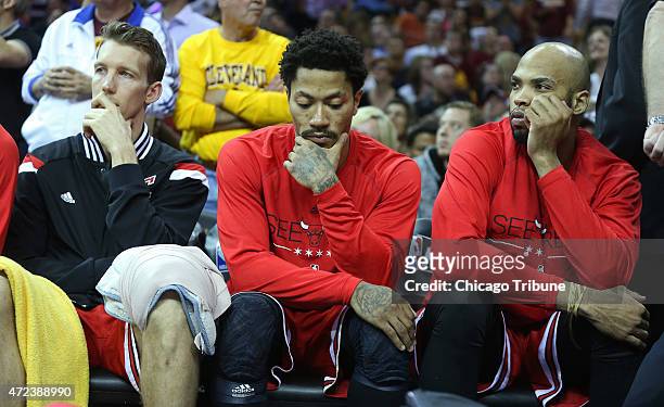 The Chicago Bulls', from left, Mike Dunleavy, Derrick Rose and Taj Gibson sit on the bench in the final seconds of a 106-91 loss against the...