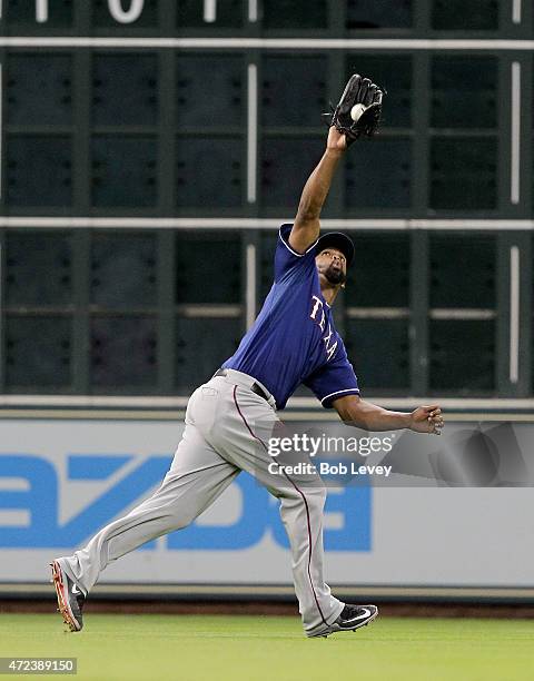 Carlos Peguero of the Texas Rangers makes a catch on a fly ball in the third inning against the Houston Astros at Minute Maid Park on May 6, 2015 in...