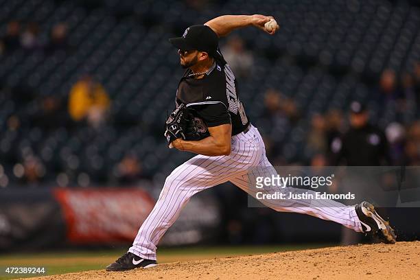 Relief pitcher Rafael Betancourt of the Colorado Rockies delivers to home plate during the eighth inning against the Arizona Diamondbacks at Coors...