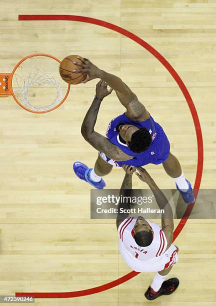 DeAndre Jordan of the Los Angeles Clippers dunks the ball against Trevor Ariza of the Houston Rockets during Game Two in the Western Conference...