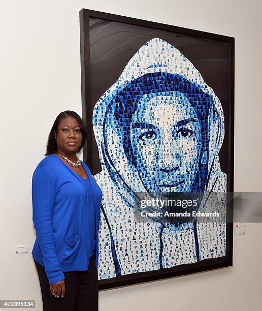 Activist Sybrina Fulton poses next to a collage of her son Trayvon Martin at the Manifest:Justice pop-up art space on May 6, 2015 in Los Angeles,...