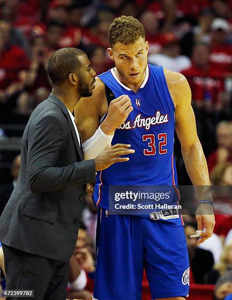 Chris Paul of the Los Angeles Clippers chats with teammate Blake Griffin on the court in the second half against the Houston Rockets during Game Two...