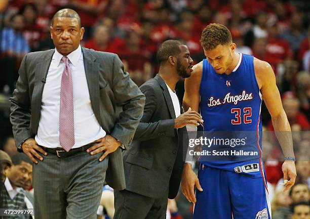 Head coach Doc Rivers of the Los Angeles Clippers waits alongside Chris Paul and Blake Griffin on the court in the second half against the Houston...