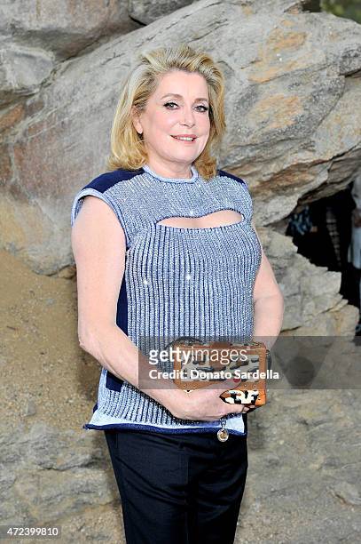 Actress Catherine Deneuve attends the Louis Vuitton Cruise 2016 Resort Collection shown at a private residence on May 6, 2015 in Palm Springs,...