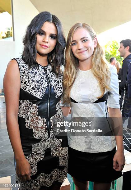 Actress/singer Selena Gomez and Britt Robertson attend the Louis Vuitton Cruise 2016 Resort Collection shown at a private residence on May 6, 2015 in...