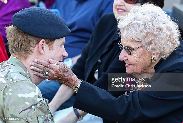 Prince Harry meets Daphne Dunne during a walkabout outside the Sydney Opera House on May 7, 2015 in Sydney, Australia. Prince Harry is visiting...