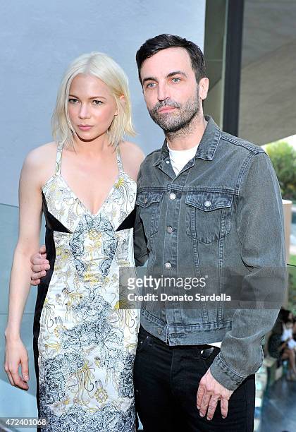 Actress Michelle Williams and designer Nicolas Ghesquiere backstage at the Louis Vuitton Cruise 2016 Resort Collection shown at a private residence...
