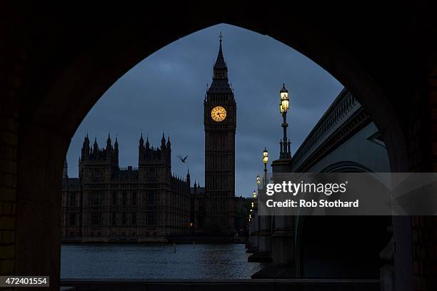 Hours before voters go to the polls a bird flies over The Houses of Parliament by Big Ben on May 7, 2015 in London, England. The United Kingdom is...