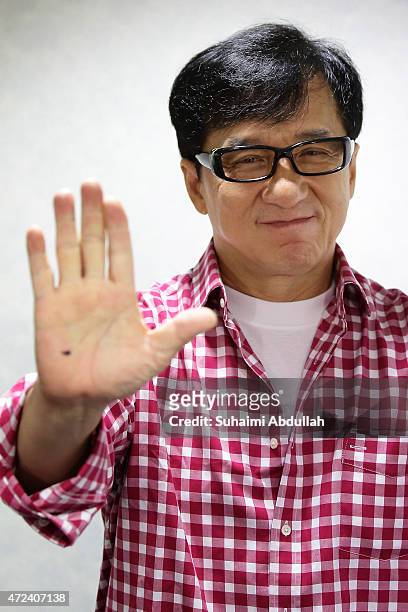 Hong actor and director, Jackie Chan poses for a photo prior to the launch of a new mobile anti-drug game application, Aversion at Nanyang...