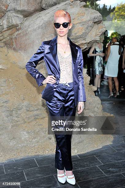 Musician Grimes attends the Louis Vuitton Cruise 2016 Resort Collection shown at a private residence on May 6, 2015 in Palm Springs, California.