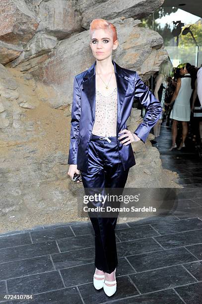 Musician Grimes attends the Louis Vuitton Cruise 2016 Resort Collection shown at a private residence on May 6, 2015 in Palm Springs, California.