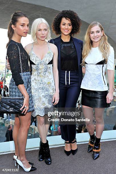 Actresses Alicia Vikander and Michelle Williams, Nathalie Emmanuel, and Britt Robertson backstage at the Louis Vuitton Cruise 2016 Resort Collection...