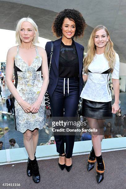 Actresses Michelle Williams, Nathalie Emmanuel, and Britt Robertson backstage at the Louis Vuitton Cruise 2016 Resort Collection shown at a private...