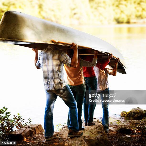 friends and canoe - aluminium boat stock pictures, royalty-free photos & images