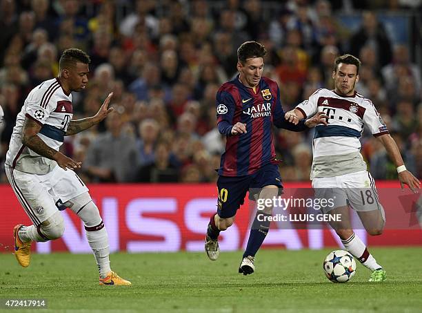 Barcelona's Argentinian forward Lionel Messi vies with Bayern Munich's Spanish defender Juan Bernat as Bayern Munich's defender Jerome Boateng...