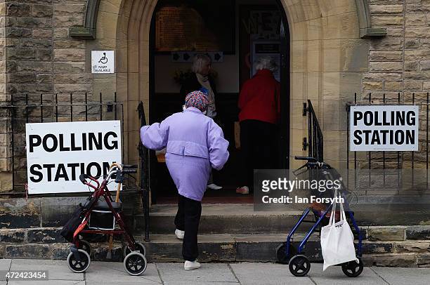 Woman walks into a polling station situated in Saltburn Methodist Church on May 7, 2015 in Saltburn, England. The United Kingdom has gone to the...