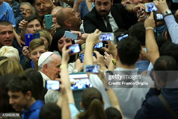 Pope Francis greets the faithful as he arrives at the Paul VI Hall for an audience with the Societa Sportiva Lazio on May 7, 2015 in Vatican City,...