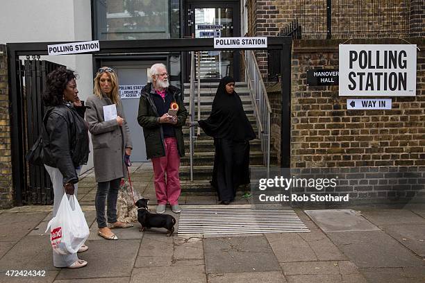 Woman leaves a polling station in the Borough of Islington on May 7, 2015 in London, United Kingdom. The United Kingdom has gone to the polls to vote...