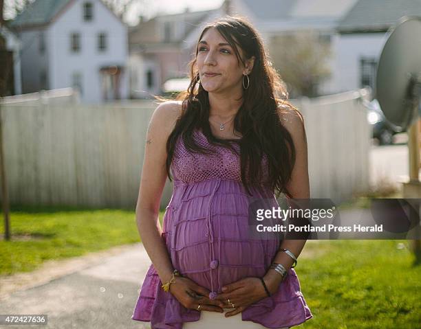 Danielle Tardy with her son Brandin Duclos outside their home in Portland, ME on Monday, May 4, 2015.
