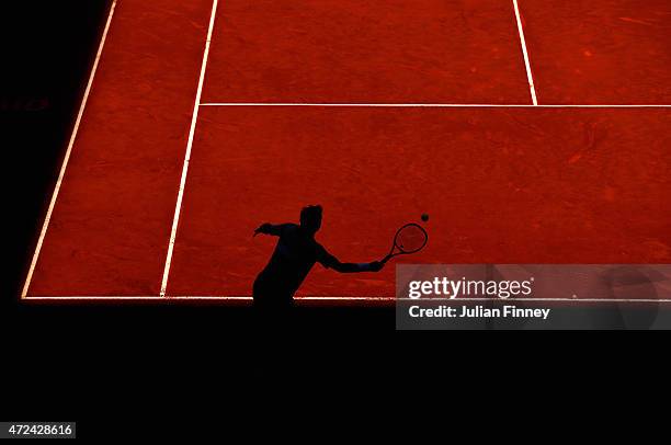 Stan Wawrinka of Switzerland returns a shot in action against Grigor Dimitrov of Bulgaria during day six of the Mutua Madrid Open tennis tournament...