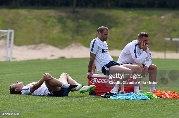 Hugo Campagnaro, Rodrigo Palacio and Lukas Podolski during FC Internazionale training session at the club's training ground at Appiano Gentile on May...