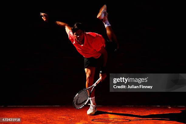 Fernando Verdasco of Spain serves to David Ferrer of Spain during day six of the Mutua Madrid Open tennis tournament at the Caja Magica on May 7,...