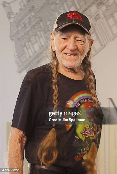 Musician Willie Nelson signs copies of his book "It's A Long Story: My Life" at Barnes & Noble Union Square on May 7, 2015 in New York City.