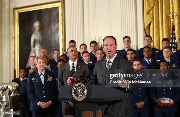 Air Force head football coach Troy Calhoun speaks as U.S. President Barack Obama listens during the Commander-in-Chief trophy presentation to the...