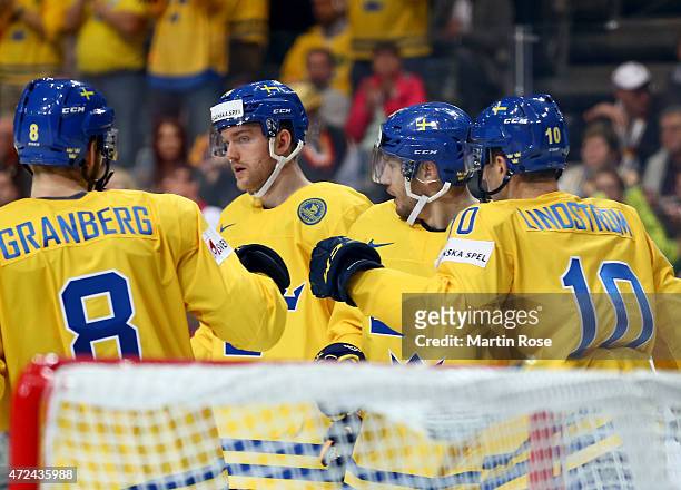 Team members of Sweden celebrate their 2nd goal during the IIHF World Championship group A match between Sweden and Germany at o2 Arena on May 7,...