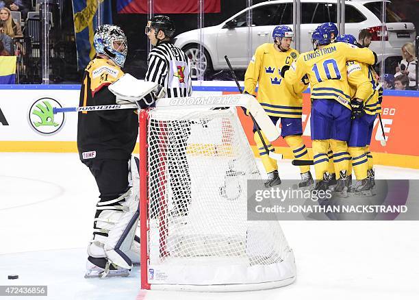 Forward Oscar Moller of Sweden celebrates with his teammates after scoring a goal during the group A preliminary round match Sweden vs Germany at the...