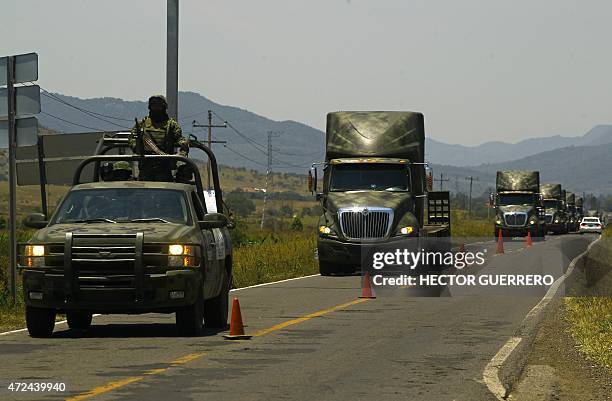 Mexican army convoys patrol the Guadalajara-Barra de Navidad highway, during the operation Jalisco in Autlan, Jalisco State, on May 07, 2015. A total...