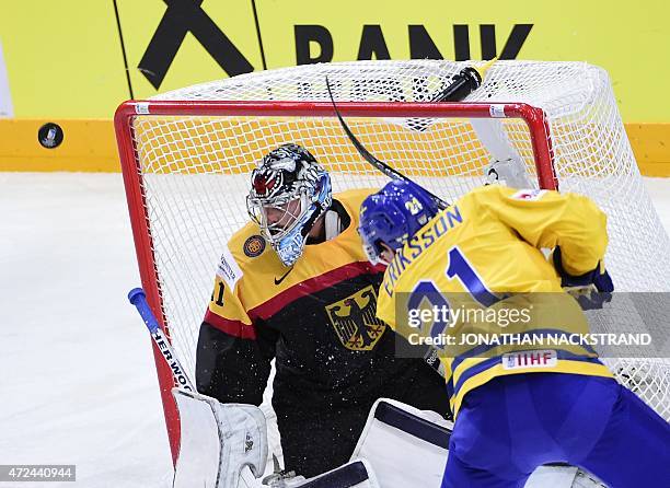 Forward Loui Ericsson of Sweden misses a shot on goalkeeper Timo Pielmeier of Germany during the group A preliminary round match Sweden vs Germany at...