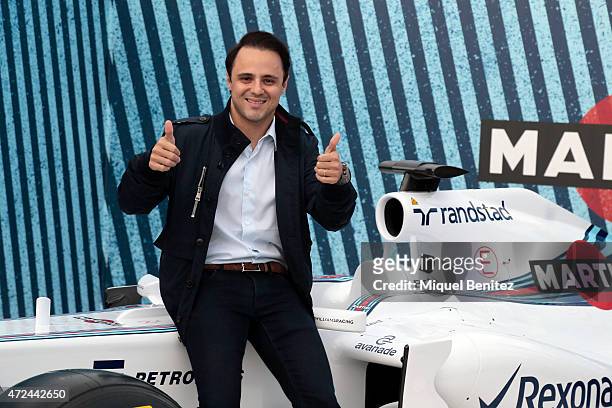 Driver Felipe Massa poses with a WILLIAMS MARTINI RACING car at Terrazza MARTINI to announce Bar Refaeli as the global MARTINI race ambassador on May...